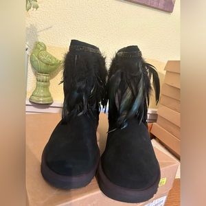 UGG Women’s short black boots. Green/black feathers., Crystal trim. NIB